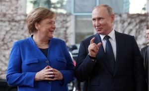 Меркель и Путин дали негативную оценку заявлениям официальных лиц Украины о необходимости пересмотра Минских соглашений